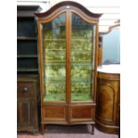 Edwardian mahogany and inlaid china cabinet with swept and domed top, two long doors on tapered