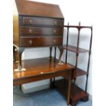 A mid Century teak twin flap dining table, a vintage mahogany fall front bureau and a reproduction