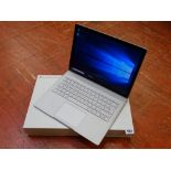 Boxed Microsoft 'Surface Book' laptop with pen