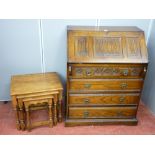 Priory style oak fall front bureau with linenfold and carved detail and a set of three