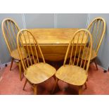 Ercol drop leaf dining table, 73 cms high, 130 cms wide, 64 cms deep (closed) and four high backed