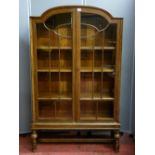 Glazed two door vintage domed top bookcase with interior adjustable shelves, 150 cms high x 91 cms