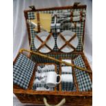 Fitted wicker picnic basket and a vintage walking stick