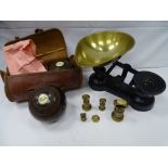A pair of vintage wooden bowling balls with ivory button detail in carry case and a reproduction set