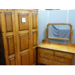 Arts & Crafts style wardrobe, single door with later added silver dialled clock to front and a
