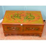 A modern Oriental red and dragon decorated two drawer coffee table, 42 cms high x 83 cms wide