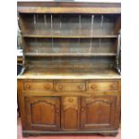 Small early 19th Century Clwydian dresser with three opening drawers, centre box drawer with panel