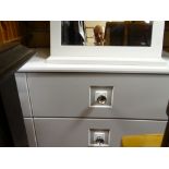 Suite of white coloured modern bedroom furniture comprising chest of three drawers, narrow chest and