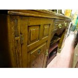 Edwardian sideboard with centre drawer and two flanking carved front cupboard doors, 182 cms wide