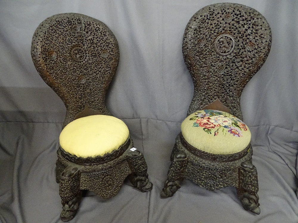 Pair of Burmese carved hardwood chairs, 100 cms high