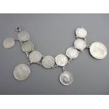 Bracelet of nine Spanish silver fifty cent coins together with a two peseta coin and a one peseta