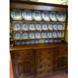 Late 19th Century oak Anglesey dresser having a three shelf rack over a breakfront base having three