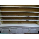 Painted pine dresser having a four shelf open rack and four base drawers, 226 cms wide, 190 cms