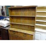 Compact pine dresser for full restoration having a twin shelf rack over a base of two drawers and