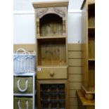 Modern pine kitchen shelving unit with lower wine rack and central drawer