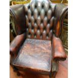 Button backed burgundy 'Ox Blood' leather wingbacked armchair