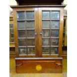 Mahogany two door wall hanging cupboard with multi-bevelled glass panelled front and inlaid design