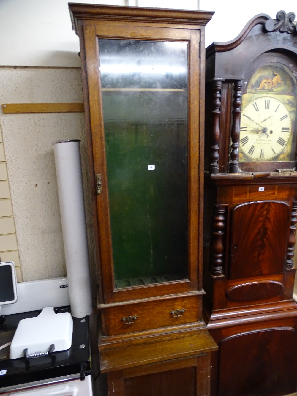 Polished single glazed door floorstanding gun cabinet with base drawer and a polished, same period