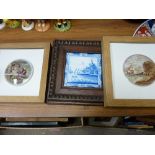 Two framed Prattware pot lids and two Dutch painted blue and white tiles in oak frames with egg