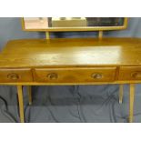 Ercol light wood oblong dressing table with three opening drawers and an open base