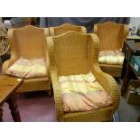 Set of four good wingback wicker armchairs with shaped back detail, 104 cms high, 67 cms wide, 58