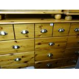 Modern pine multi-drawer chest, 130 cms wide