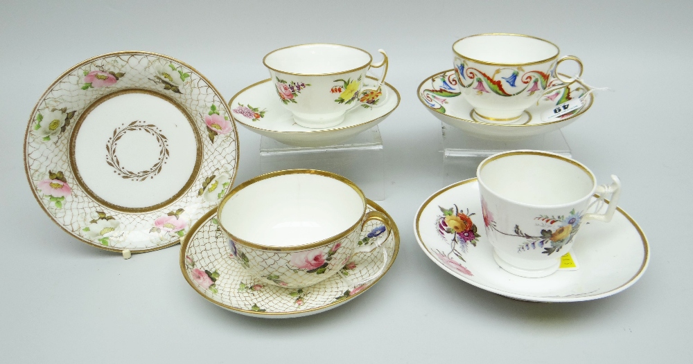 A GROUP OF FOUR SWANSEA PORCELAIN CUPS & SAUCERS comprising (1) a teacup with with scroll loop