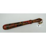 A SWANSEA GAOLER'S TRUNCHEON of turned form with pointed rounded handle and with painted crest