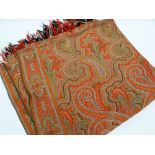 A NORTH WALES SQUARE COTTON PAISLEY SHAWL intricately embroidered and with fringed border, approx