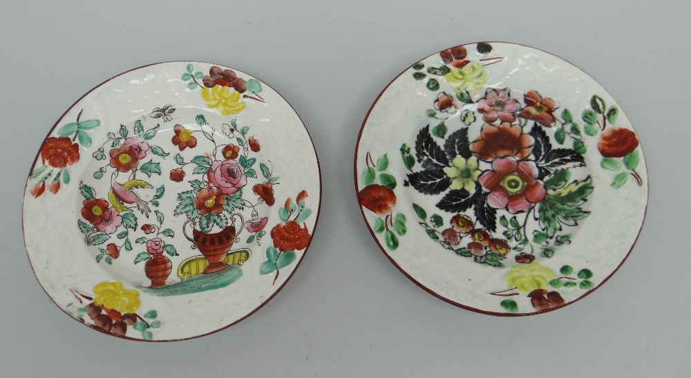 A GOOD PAIR OF BAKER, BEVANS & IRWIN CHILD'S PLATES with floral decoration and moulded borders