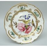 A RARE NANT GARW PORCELAIN DESSERT PLATE decorated with a centred bird (intriguingly with human-