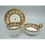 A SWANSEA PORCELAIN PARIS FLUTE CRESTED TRIO the border decorated with shell reserve in gilding
