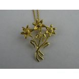 A PURE WELSH GOLD PENDANT WITH ROYAL FAMILY ASSOCIATION "Snowdonia Lily" in nine carat gold and with