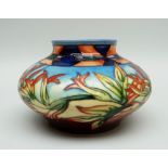 A MOORCROFT POTTERY SQUAT VASE in the 'Indian Paintbrush' pattern dated 2000, 12cms high (boxed)