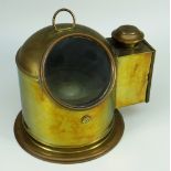 A VINTAGE BRASS ENCASED COMPASS ON GIMBAL