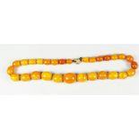 GRADUATED STRING OF AMBER BEADS, 38cms long approx. 28 grams approx.