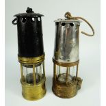 TWO ANTIQUE MINERS LAMPS one with painted black finish, the other with steel section