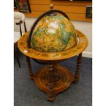 A LATE C20TH REPRODUCTION TERRESTRIAL GLOBE COCKTAIL CABINET