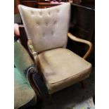 A VINTAGE WOODEN ARMED CHAIR with buttoned back in cream leatherette covering and a HK maker's