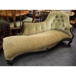 A VICTORIAN SERPENTINE-FRONT BUTTONED CHAISE LONGUE on carved scrolling supports