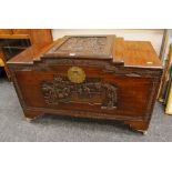 AN ORIENTAL CAMPHORWOOD CHEST having deep carved panels to front, sides and top, featuring sailing