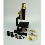 A PHILIP HARRIS OF BIRMINGHAM VINTAGE MICROSCOPE with brass adjustment and lens, TOGETHER WITH tin