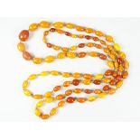 GRADUATED STRING OF AMBER BEADS, 152cms long approx. 70 grams approx.