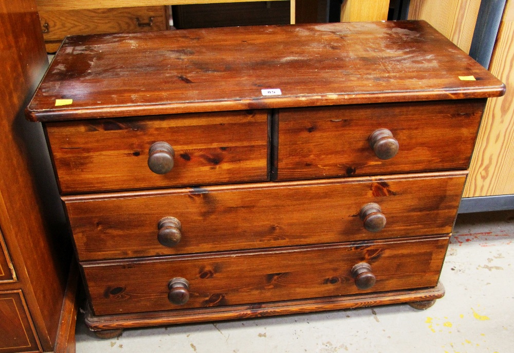 A STAINED PINE CHEST OF TWO-LONG & TWO-SHORT DRAWERS