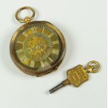 14 CARAT GOLD SCROLL AND FOLIATE ENGRAVED FOB WATCH with winder 33.8 grams approx. the watch