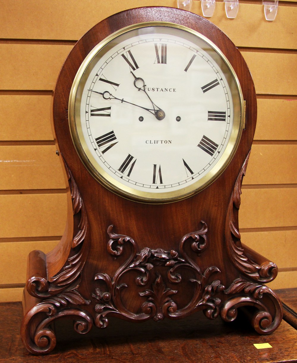 A GOOD TWIN FUSEE CARVED MAHOGANY ENCASED MANTEL CLOCK having a circular dial bearing Roman