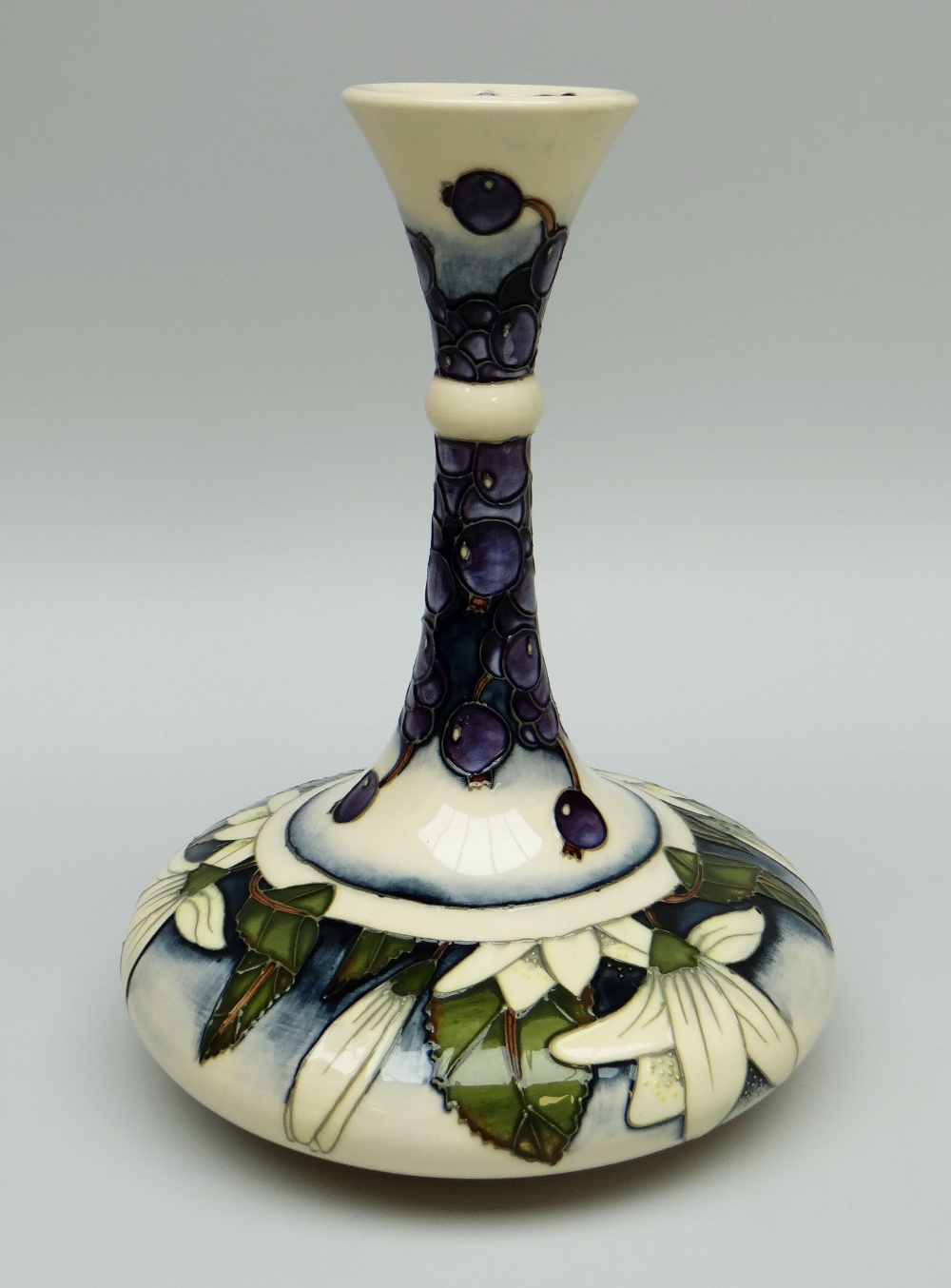 A MOORCROFT BOTTLE VASE in the 'June Berry' pattern by Anji Davenport dated 2000 limited edition 9/