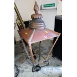 AN ANTIQUE METALWORK STREET LANTERN ENCASEMENT with circular finial