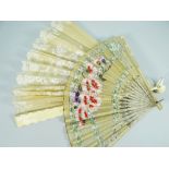 A FINE CARVED IVORY (BELIEVED) AND LACE FAN, TOGETHER WITH another fan inscribed 'Winter and