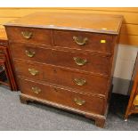AN ANTIQUE OAK CHEST of three long and two short drawers, having original brass handles and on